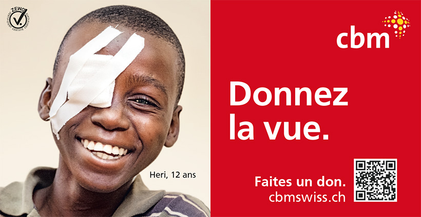 Annonce avec la photo de Heri, 12 ans, un Tanzanien au large sourire qui porte un pansement sur un œil. A sa droite, sur un fond rouge, on peut lire: Offrez la vue. Faites un don: cbmswiss.ch.